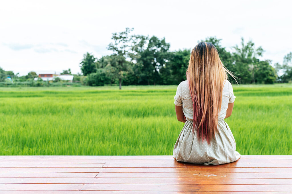 Women'S Hair Loss After Pregnancy: A Research-Based Overview 4 woman sitting and relax on wood bridge with their 2025 01 16 15 47 40 utc