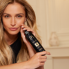Woman holds Intact 5 Pre-Shampoo