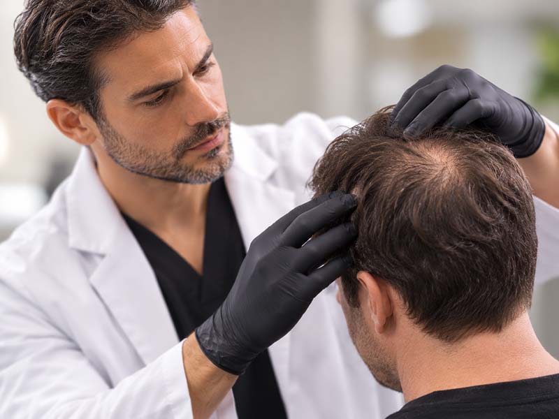 What Makes Elevai Renew™ Different From An Ordinary Hair Serum? 4 doctor check the patient's scalp hair